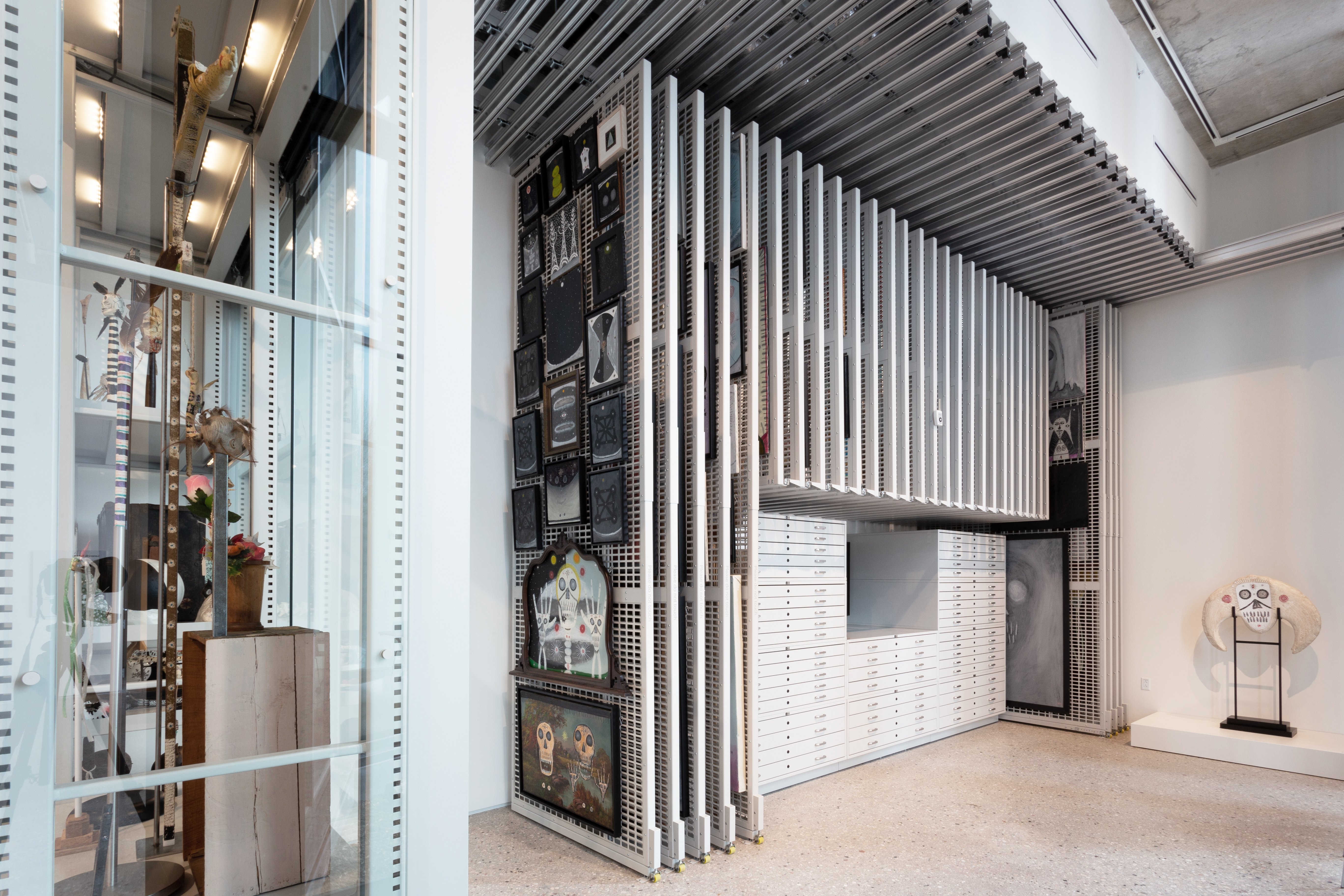 Ceiling-Mounted Racks Pull out Over Flat-File Cabinets